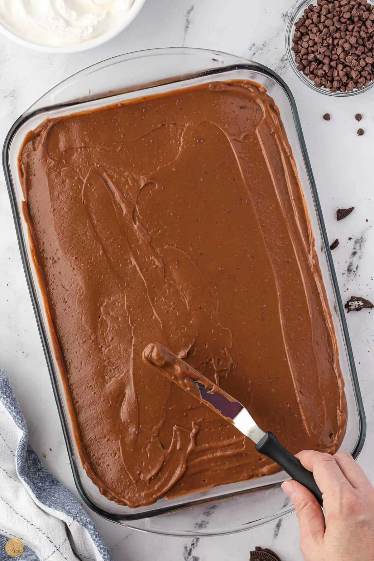 offset spatula on a layer of chocolate pudding