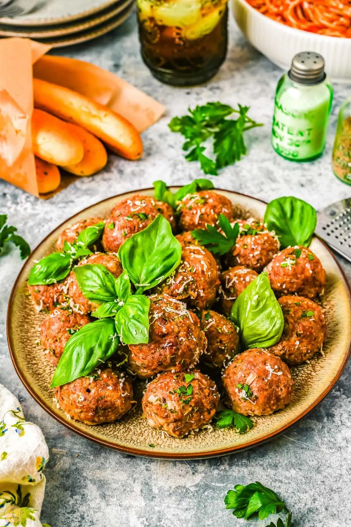 plate of meatballs with fresh basil