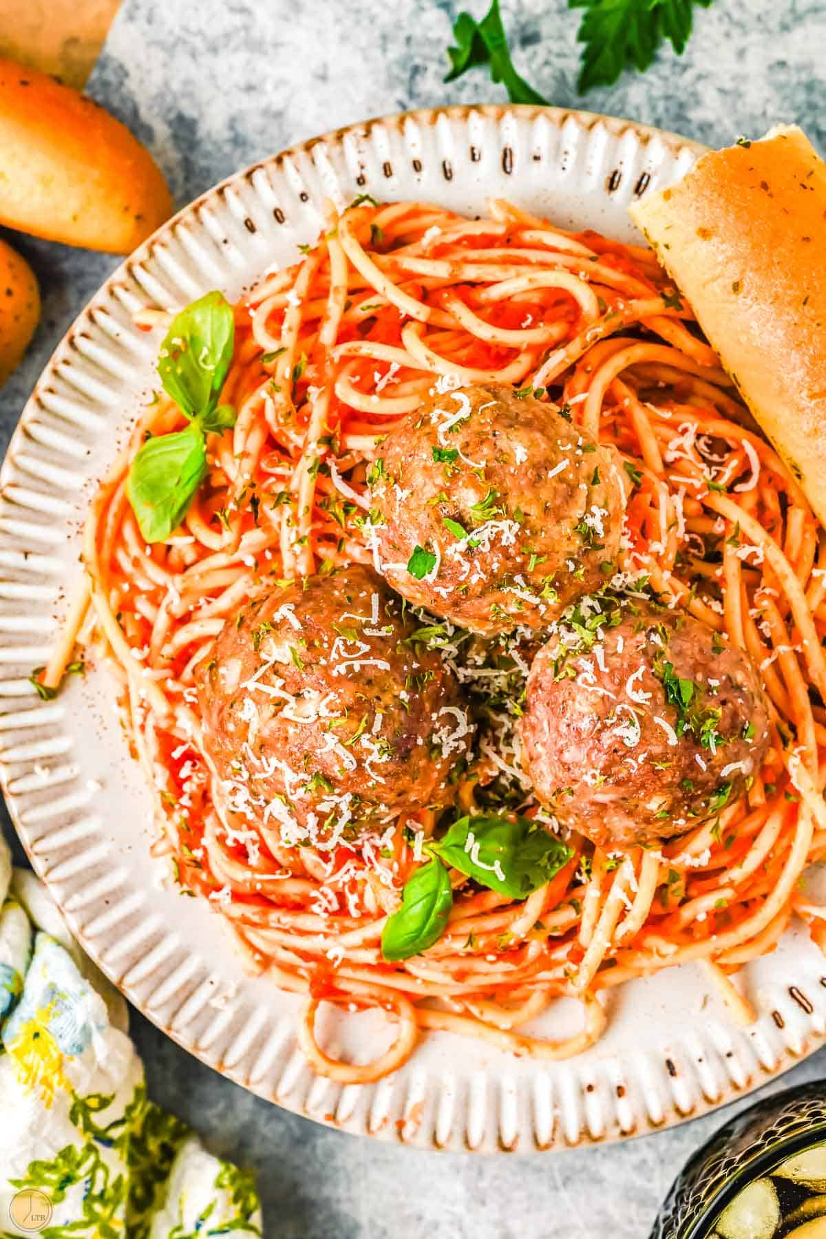 plate of spaghetti and three meatballs