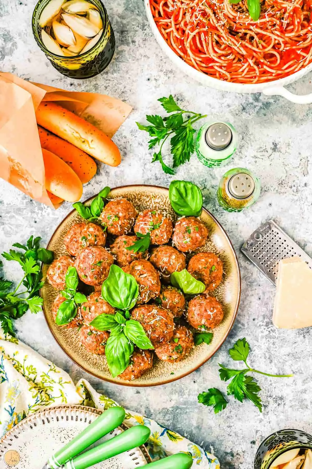 overhead plate of meatballs next to breadsticks