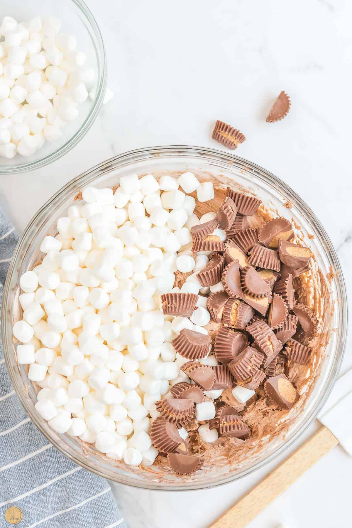 mini marshmallows and chopped peanut butter cups in a clear bowl