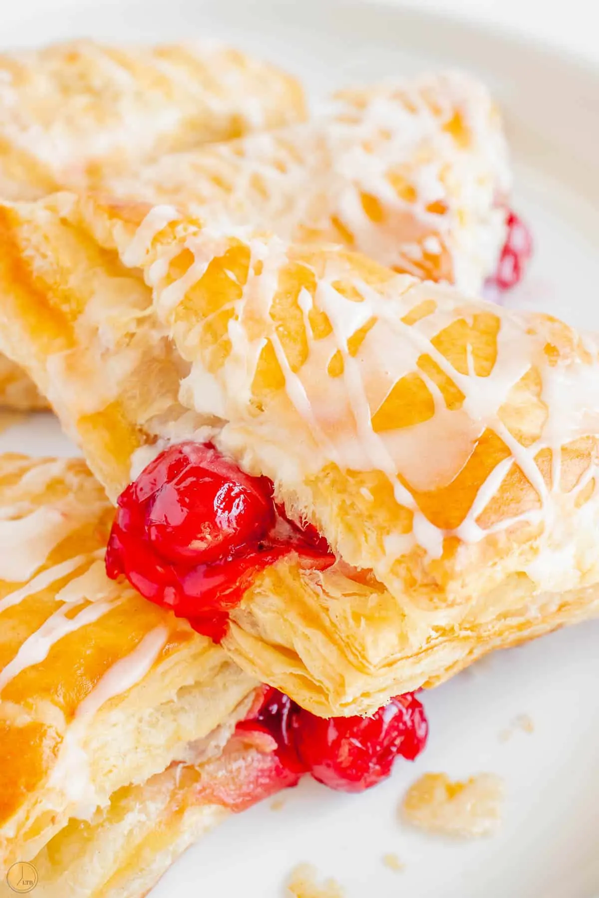 flaky cherry turnovers on a plate