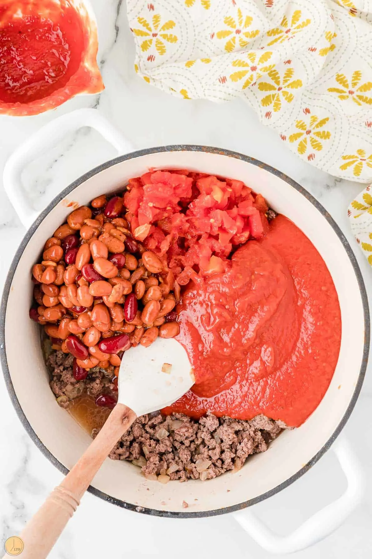 ground beef, tomatoes, and beans in a pot