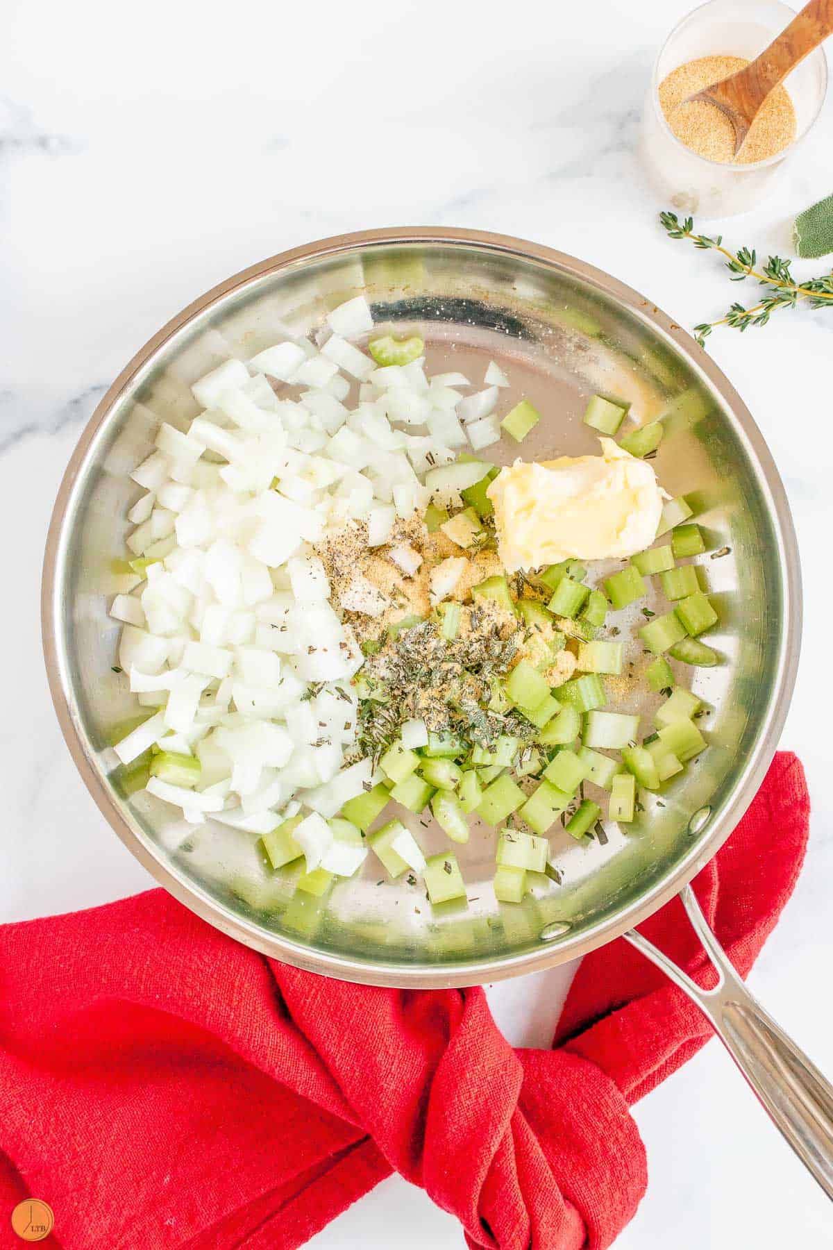 celery and onion in a sauce pan