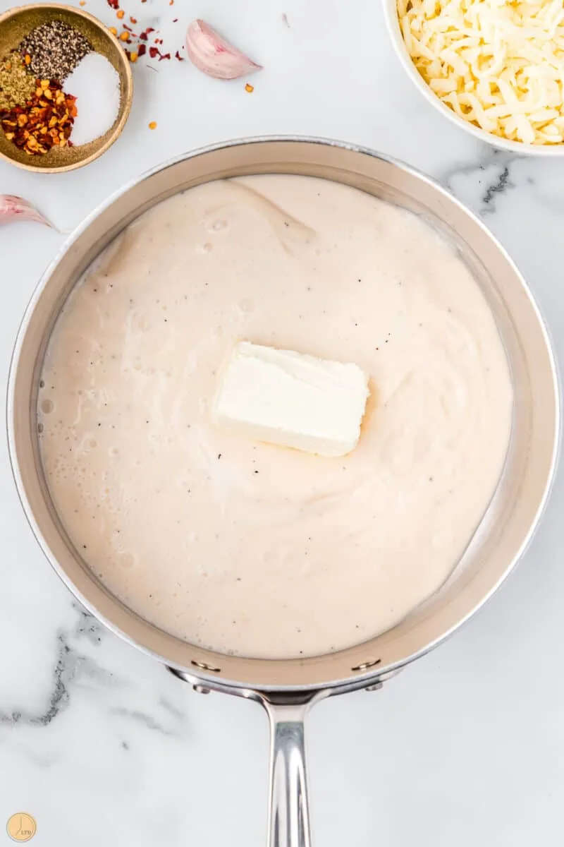 sauce and cream cheese in a pot
