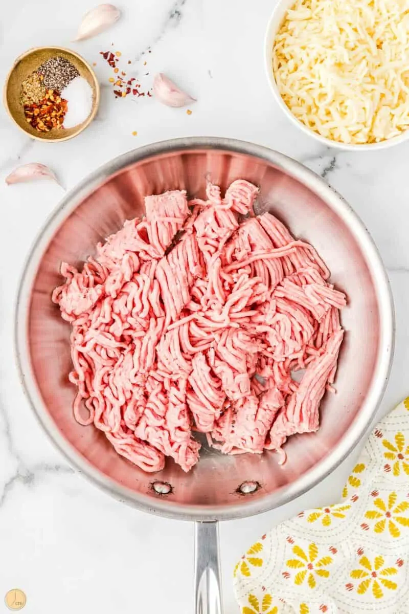 raw ground beef in a skillet