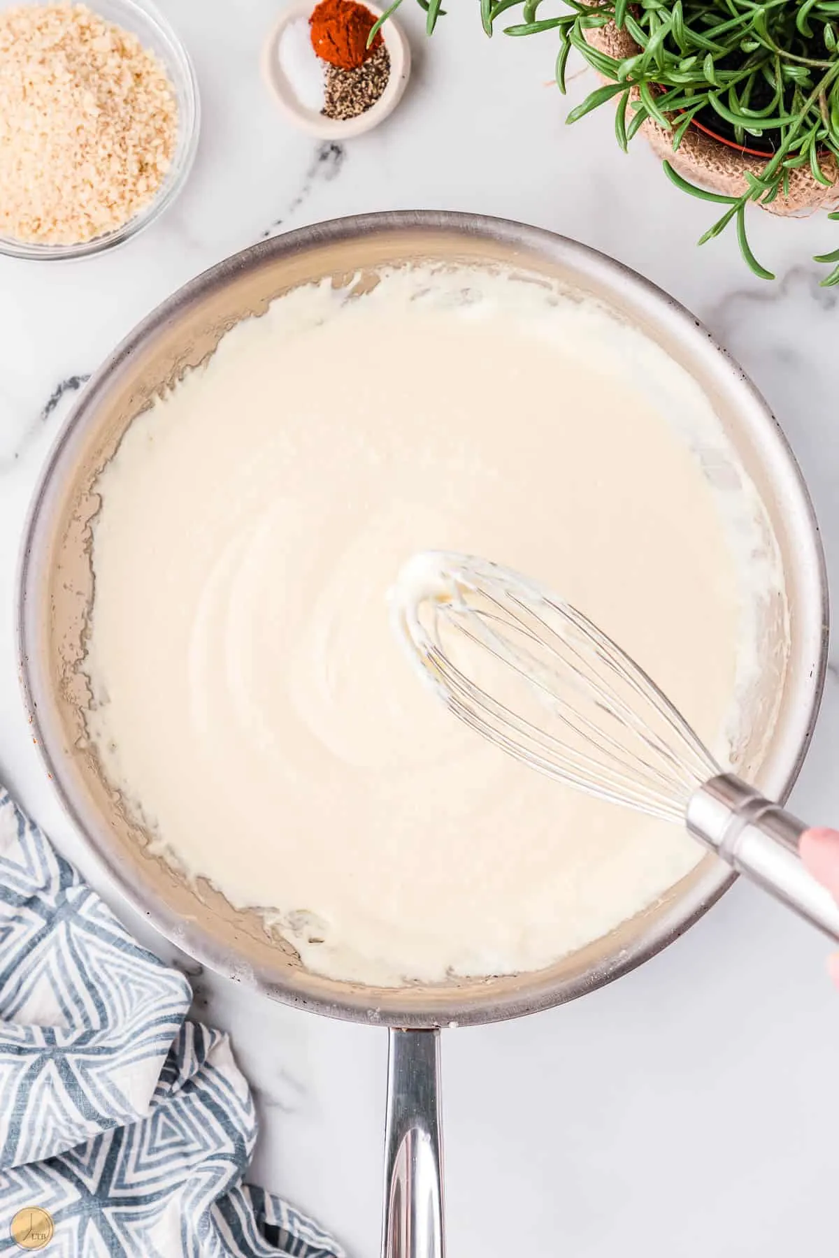 roux in a skillet with a whisk