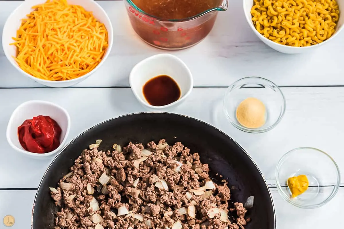 cooked ground beef and onion in a skillet
