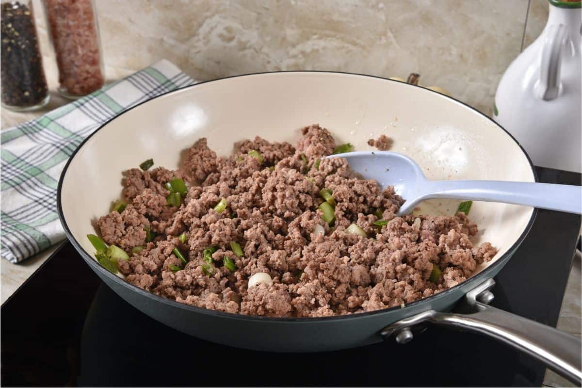 skillet of cooked ground beef and onions