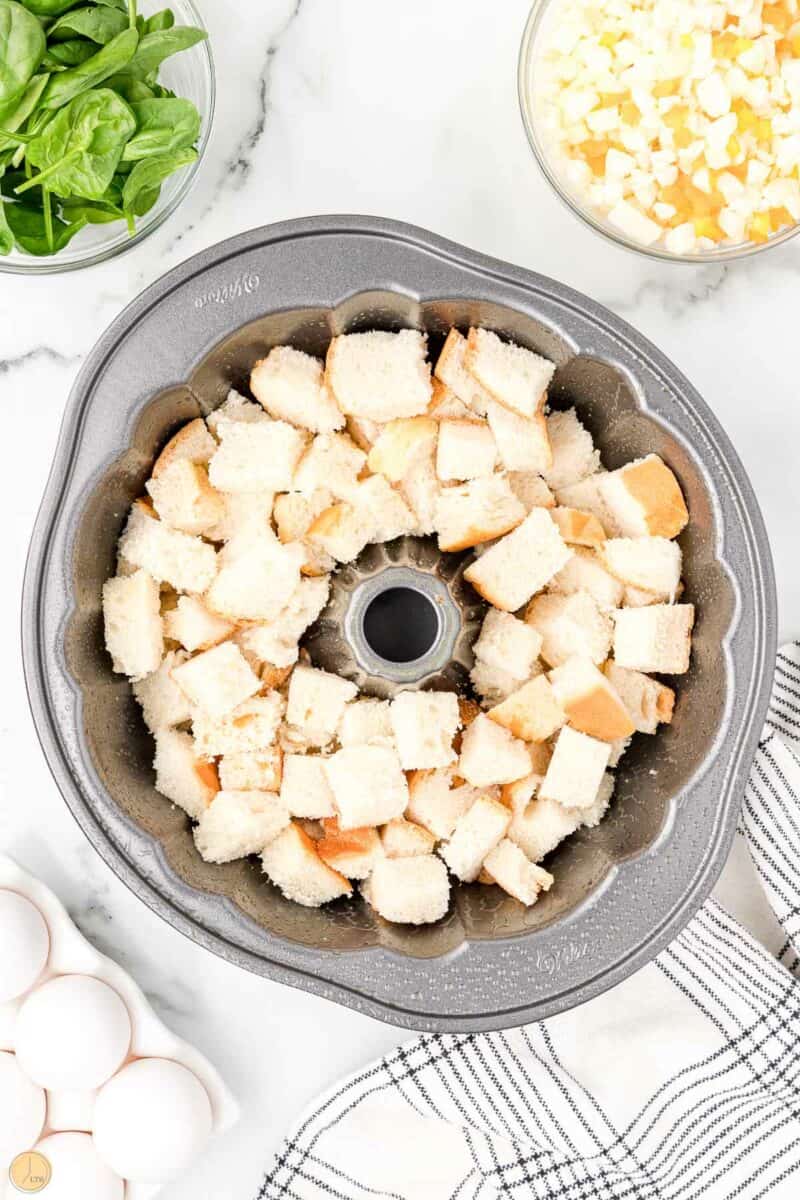 bread cubes in a bundt pan