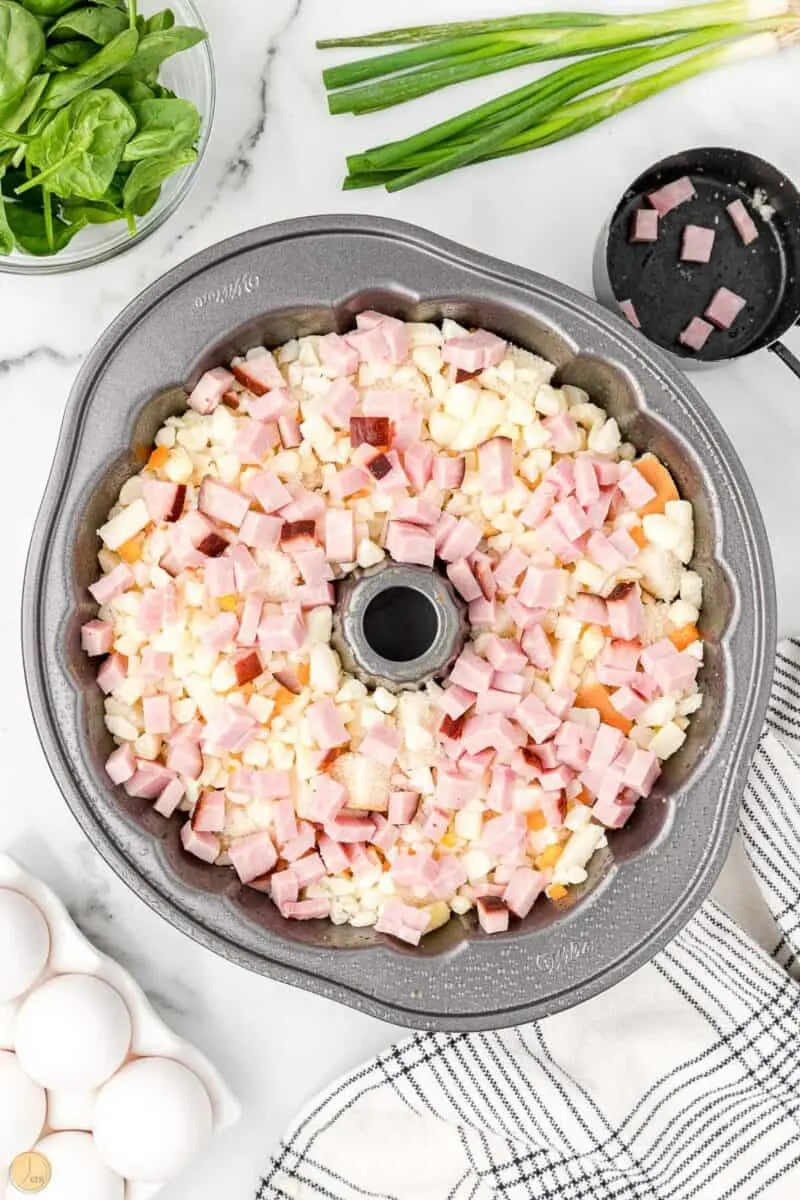 diced ham and potatoes in a bundt pan