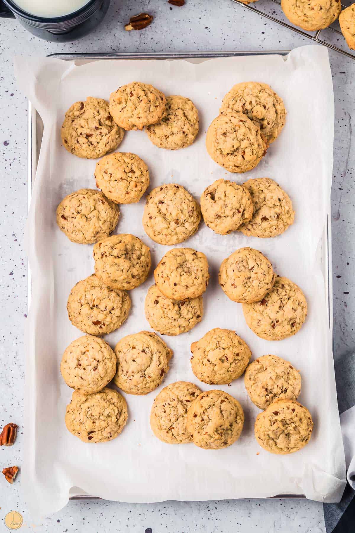 parchment lined baking sheet with cookies on top