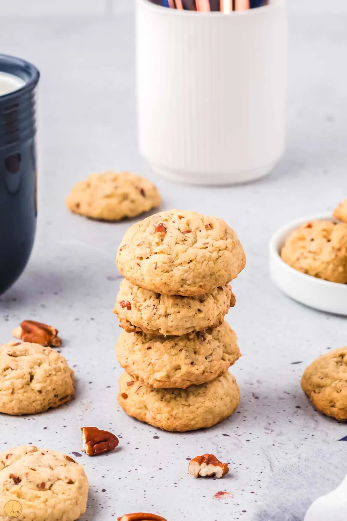 stack of brown butter pecan cookies on a marble surface
