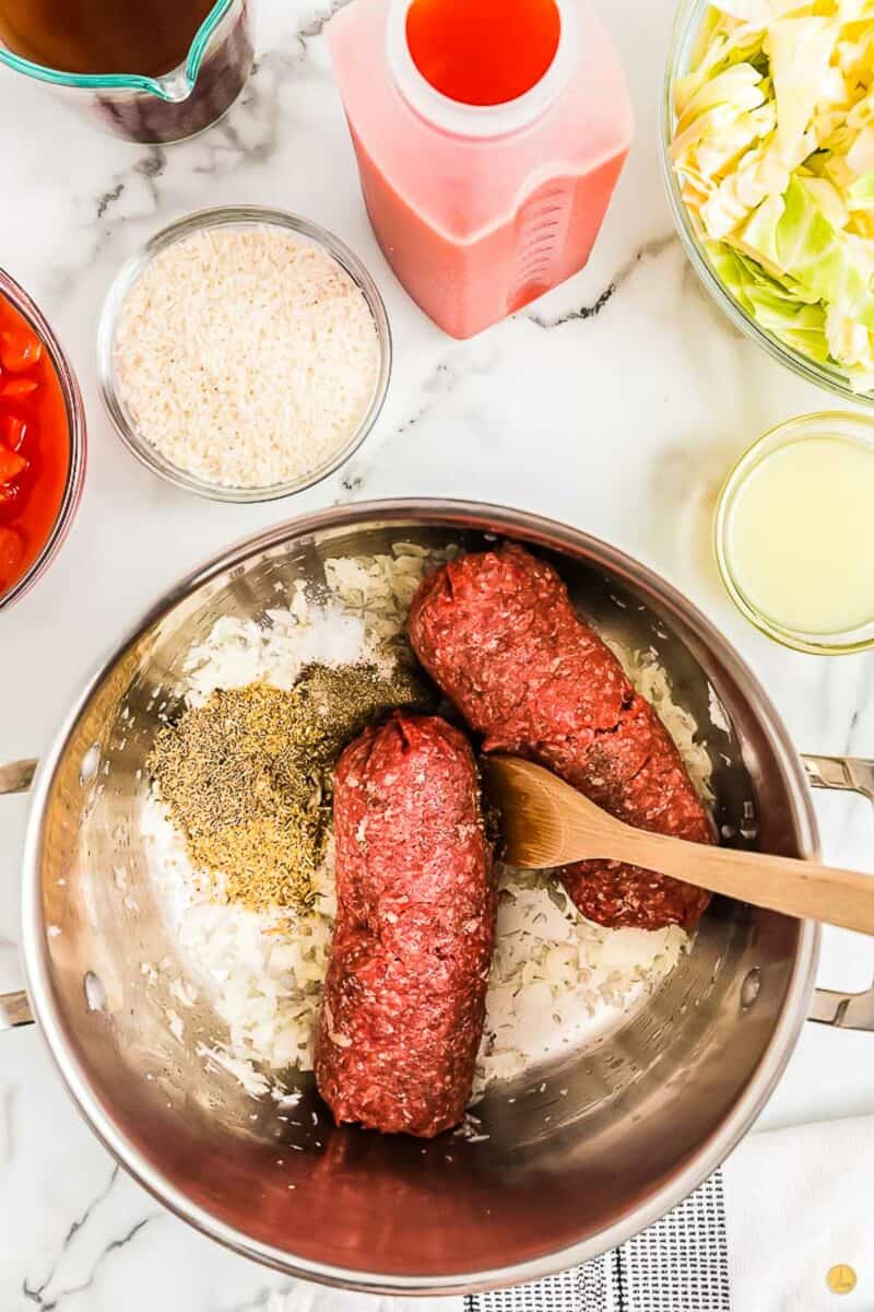 ground beef and onions cooking in a pot
