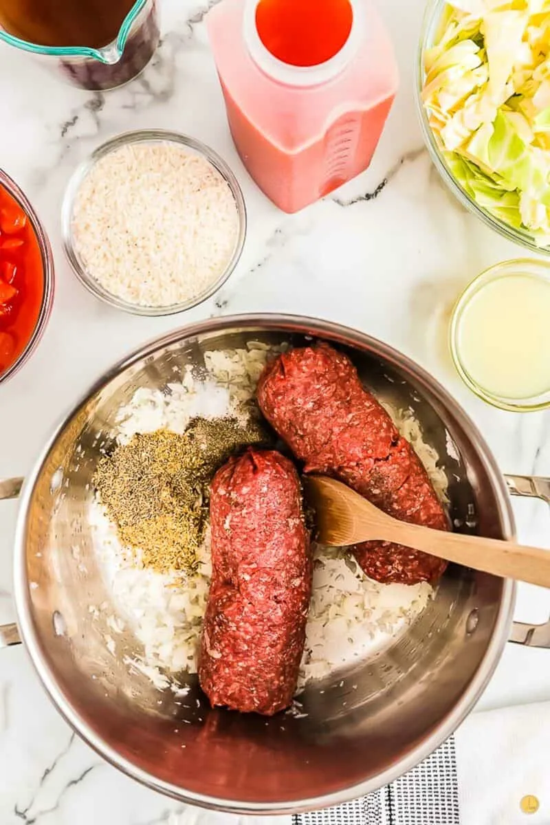 ground beef and onions cooking in a pot