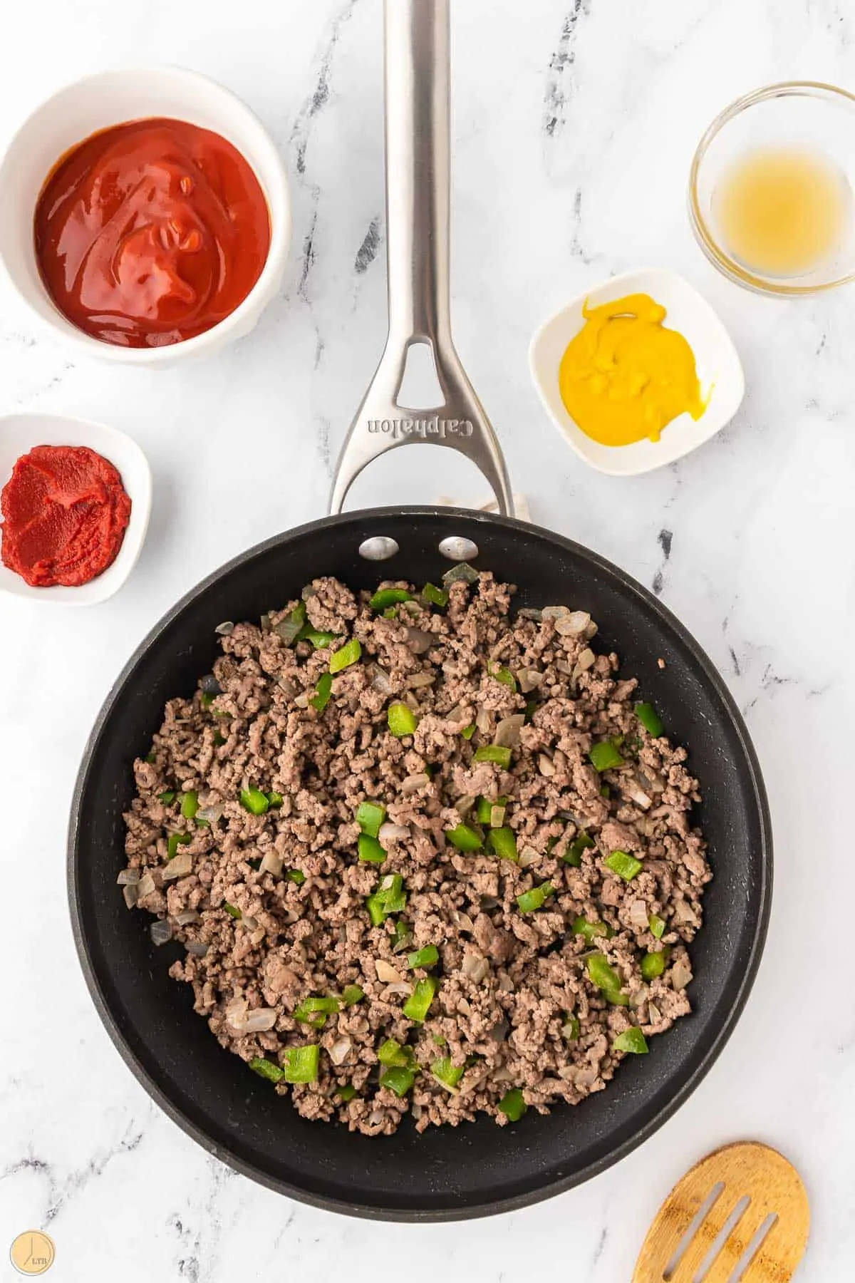 cooked hamburger and peppers in a skillet