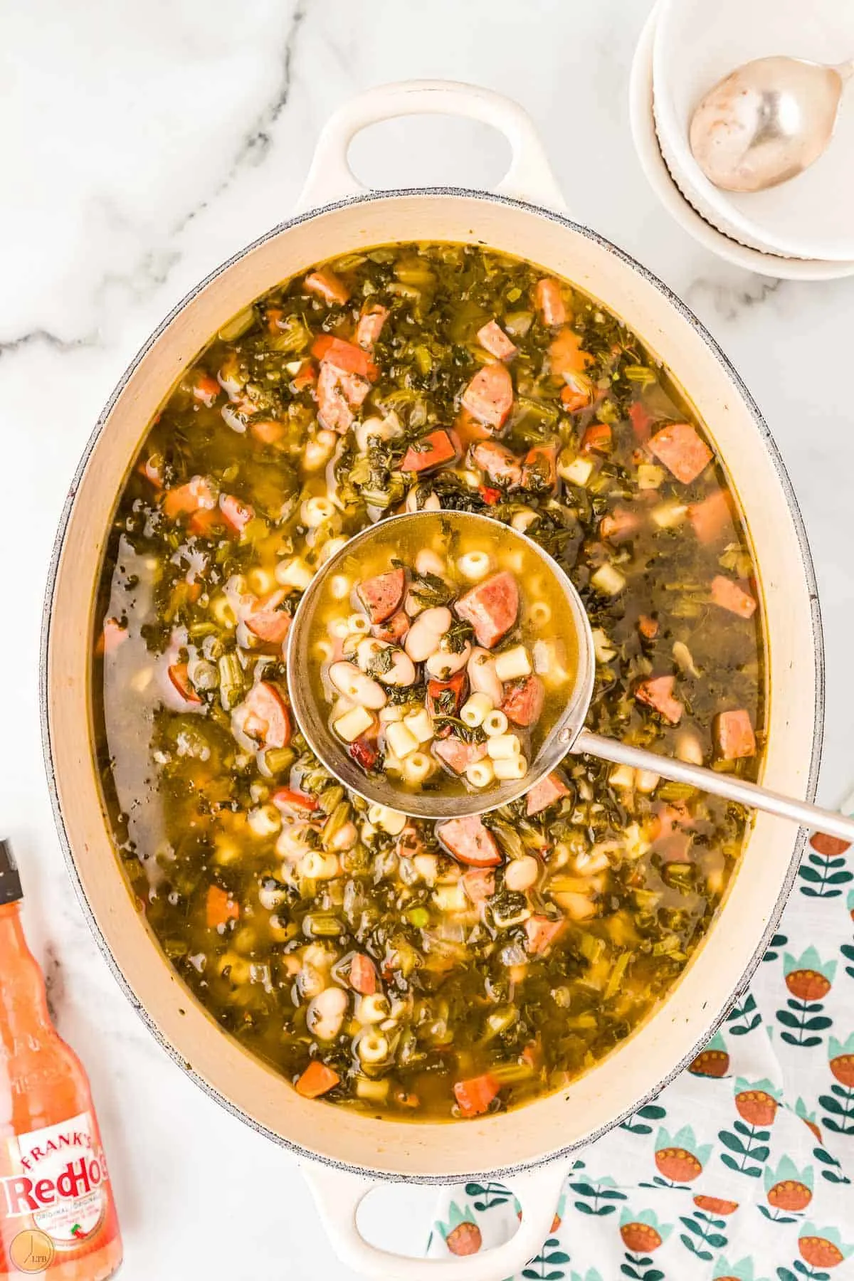 overhead picture of pot of soup with a ladle