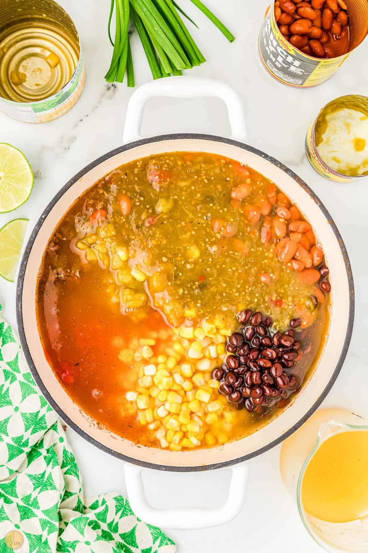 pot of unstirred soup and beans and corn