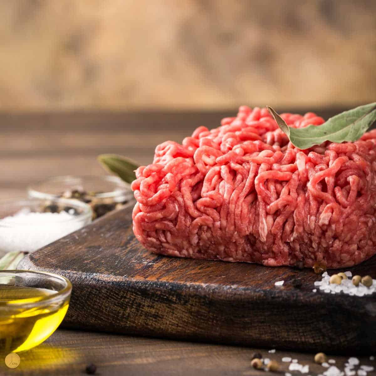 block of ground beef on wood board