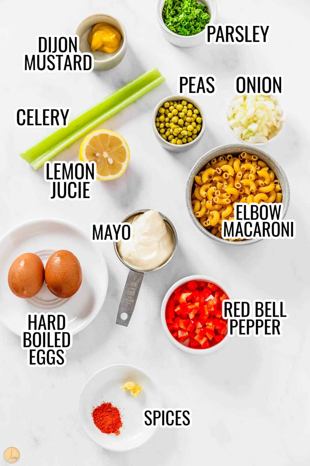 ingredients for cold pasta salad in individual bowls