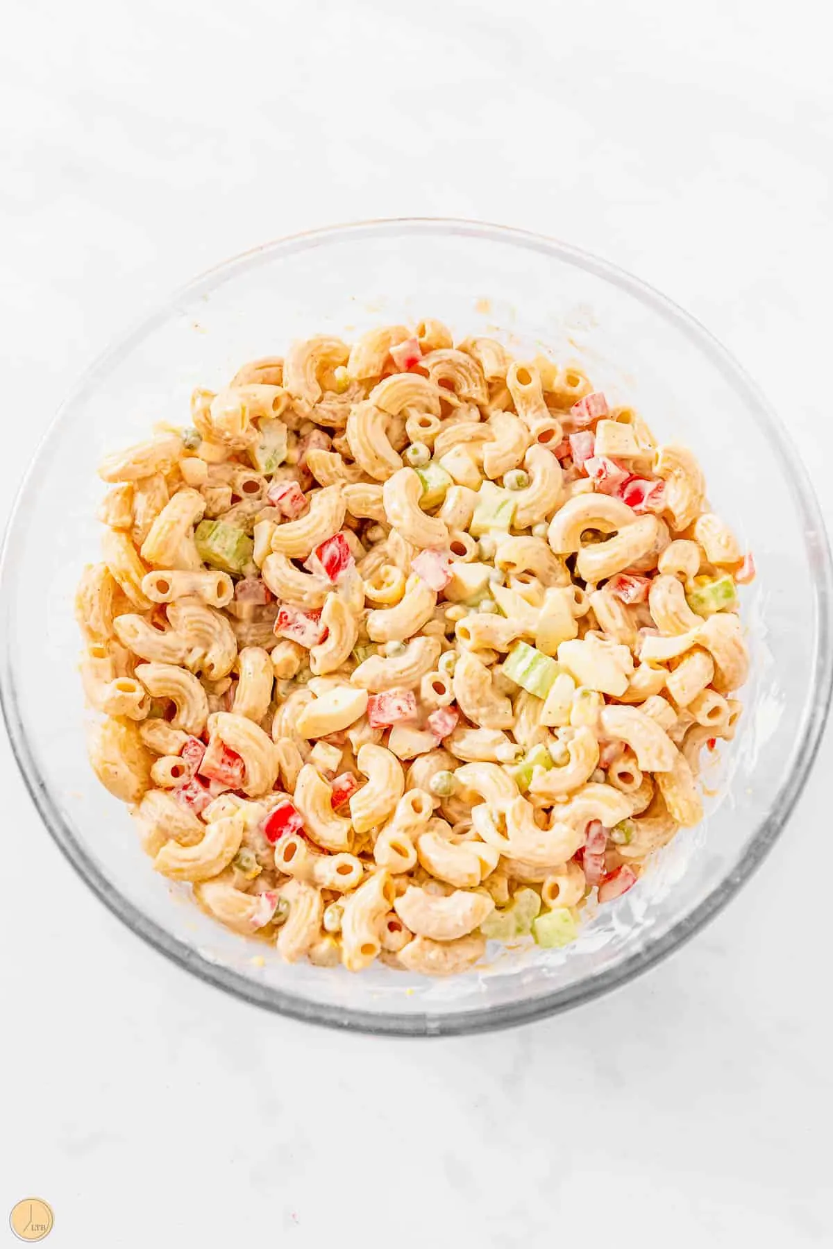 classic southern macaroni salad in a clear bowl