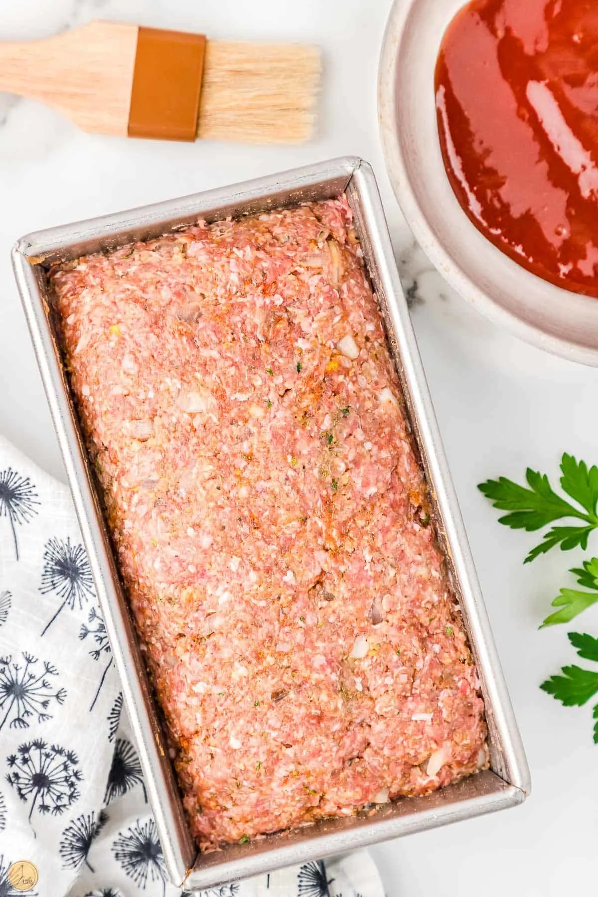 beef mixture in a loaf shape pan