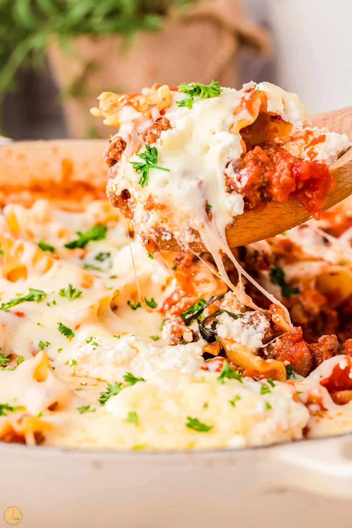 skillet lasagna on a spoon with cheese