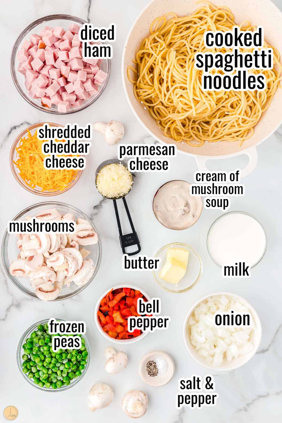 uncooked spaghetti and other ingredients in bowls