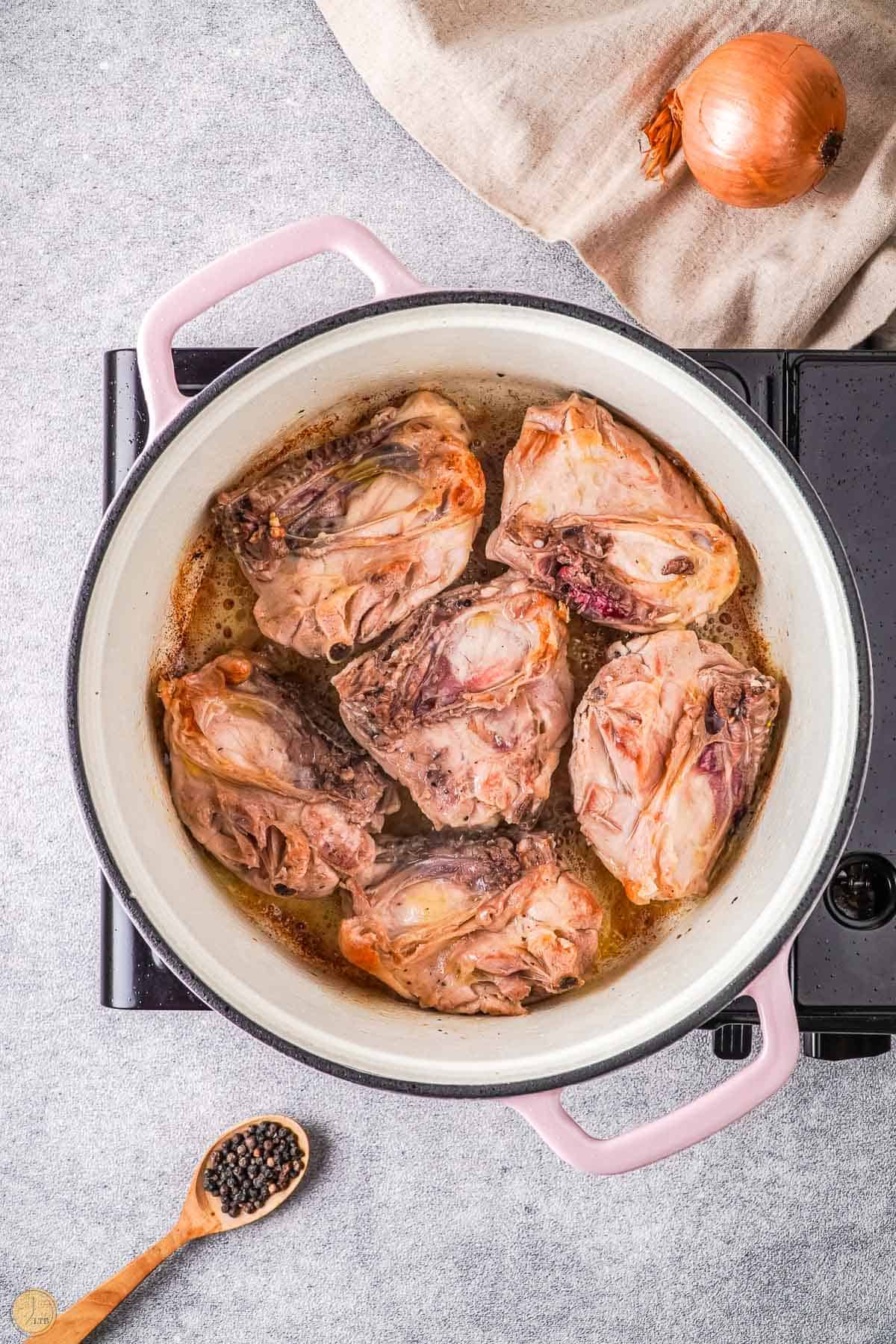 seared chicken in bottom of the pot