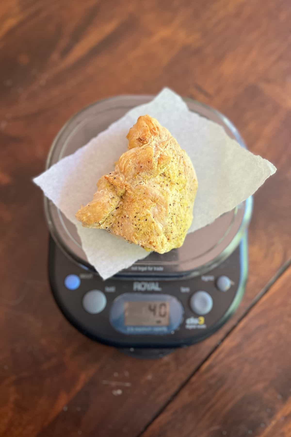 cooked chicken on a kitchen scale