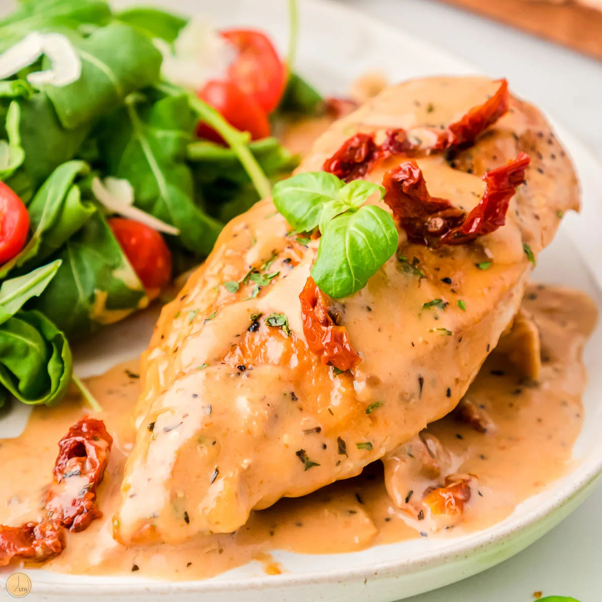 creamy tuscan chicken on a plate