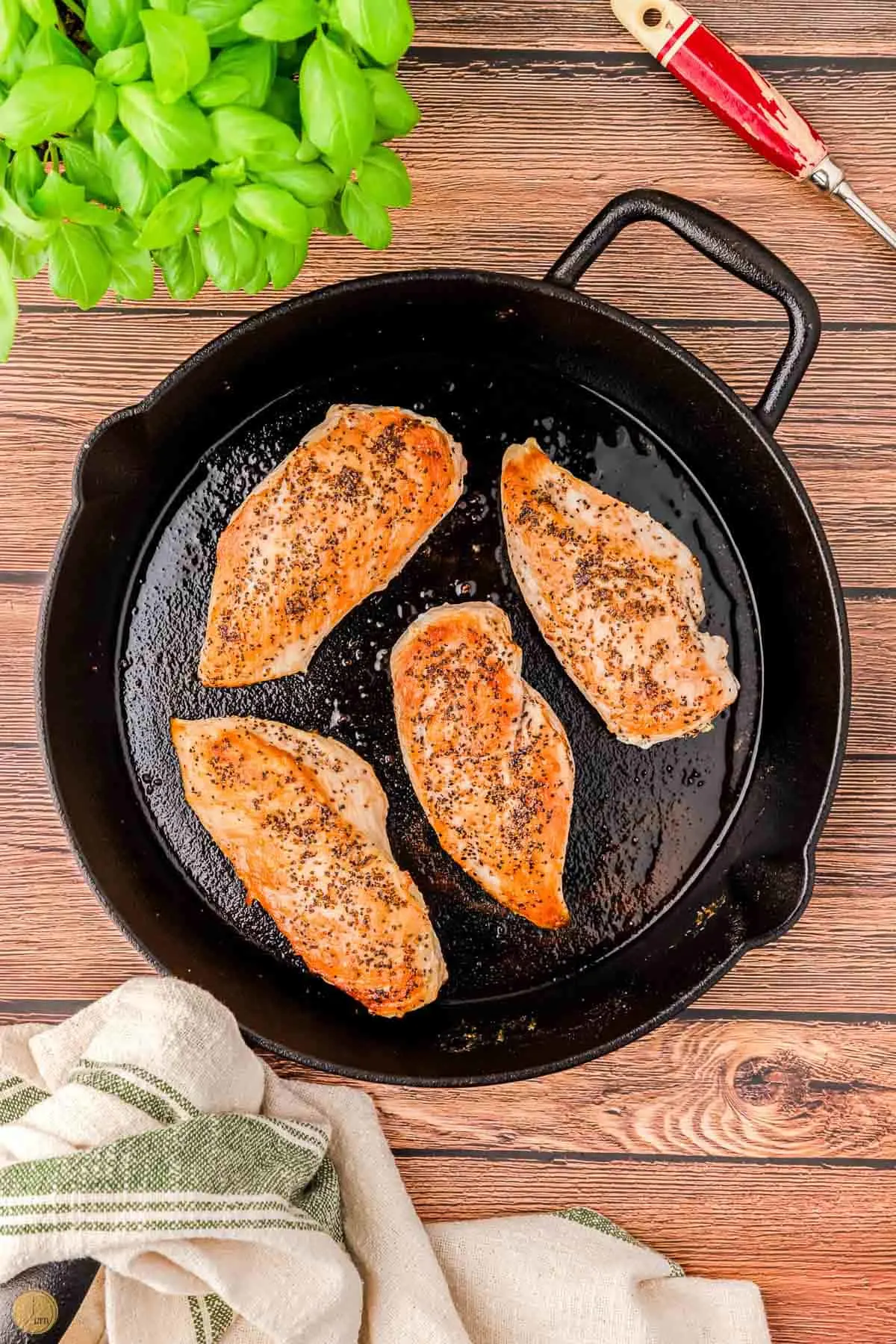 cooked chicken cutlets in a skillet