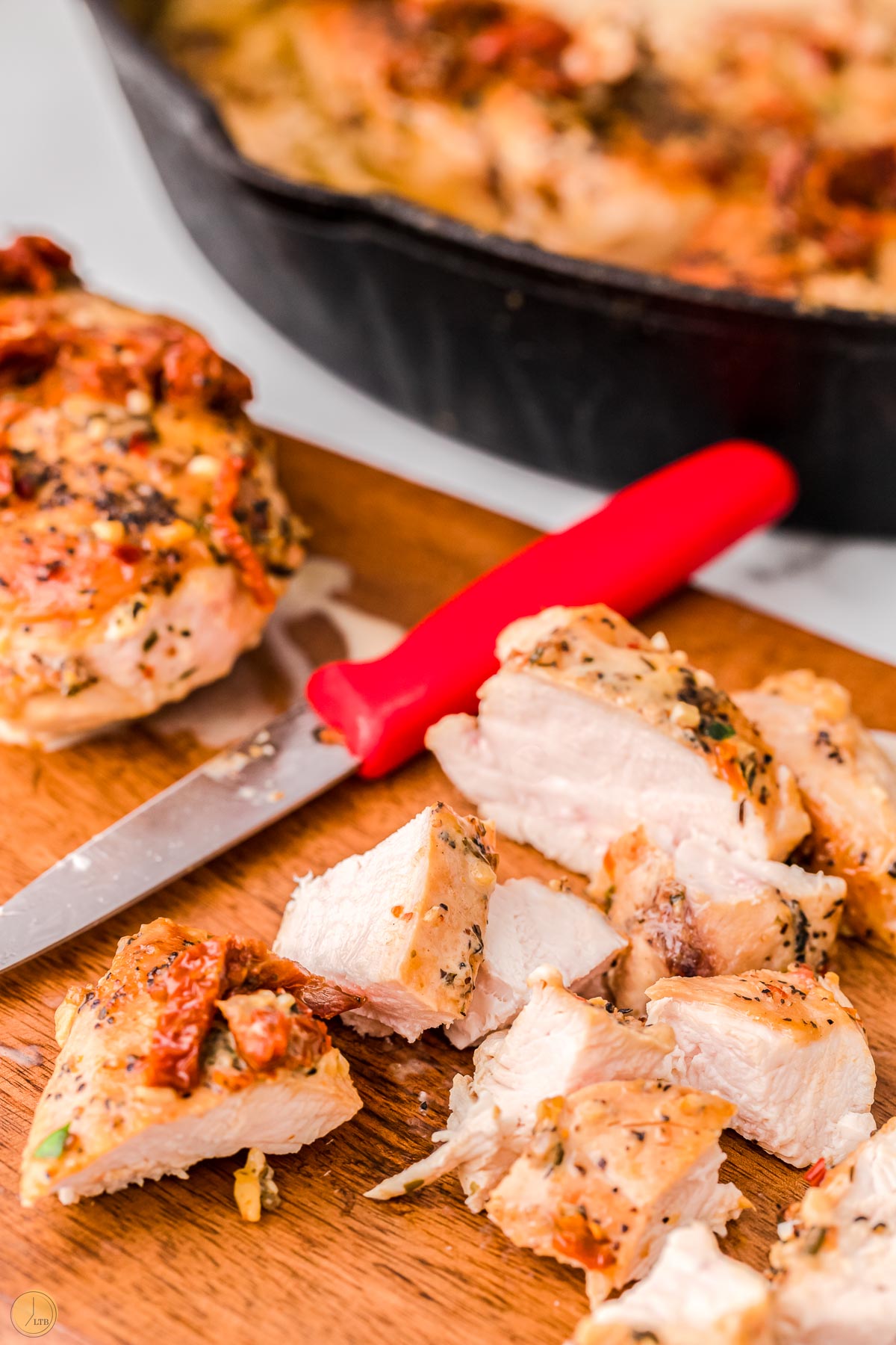 sliced chicken on wood board