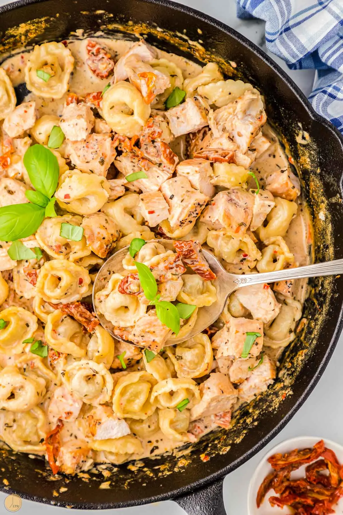 skillet of marry me chicken and tortellini