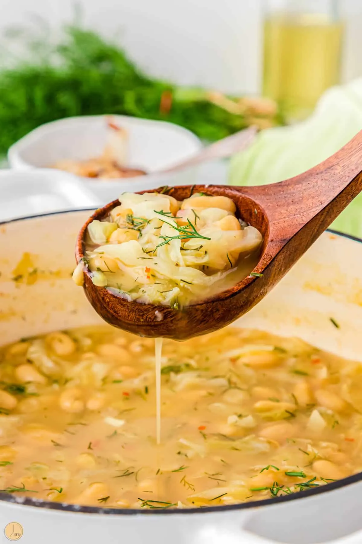 soup in a wooden spoon