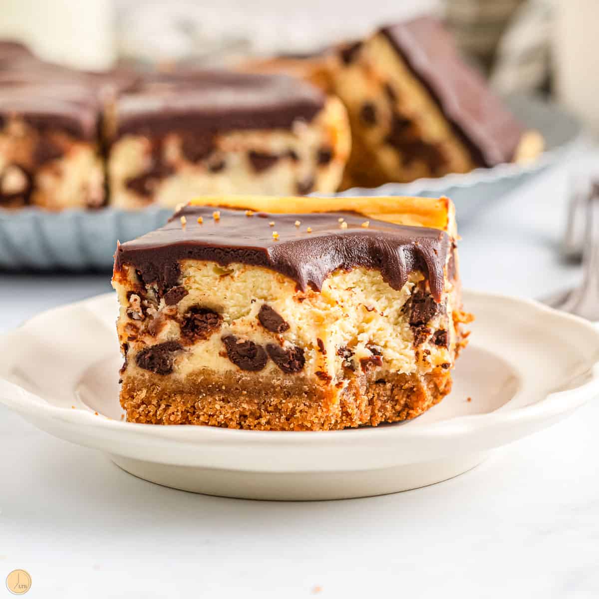 chocolate chip cheesecake bars on a plate