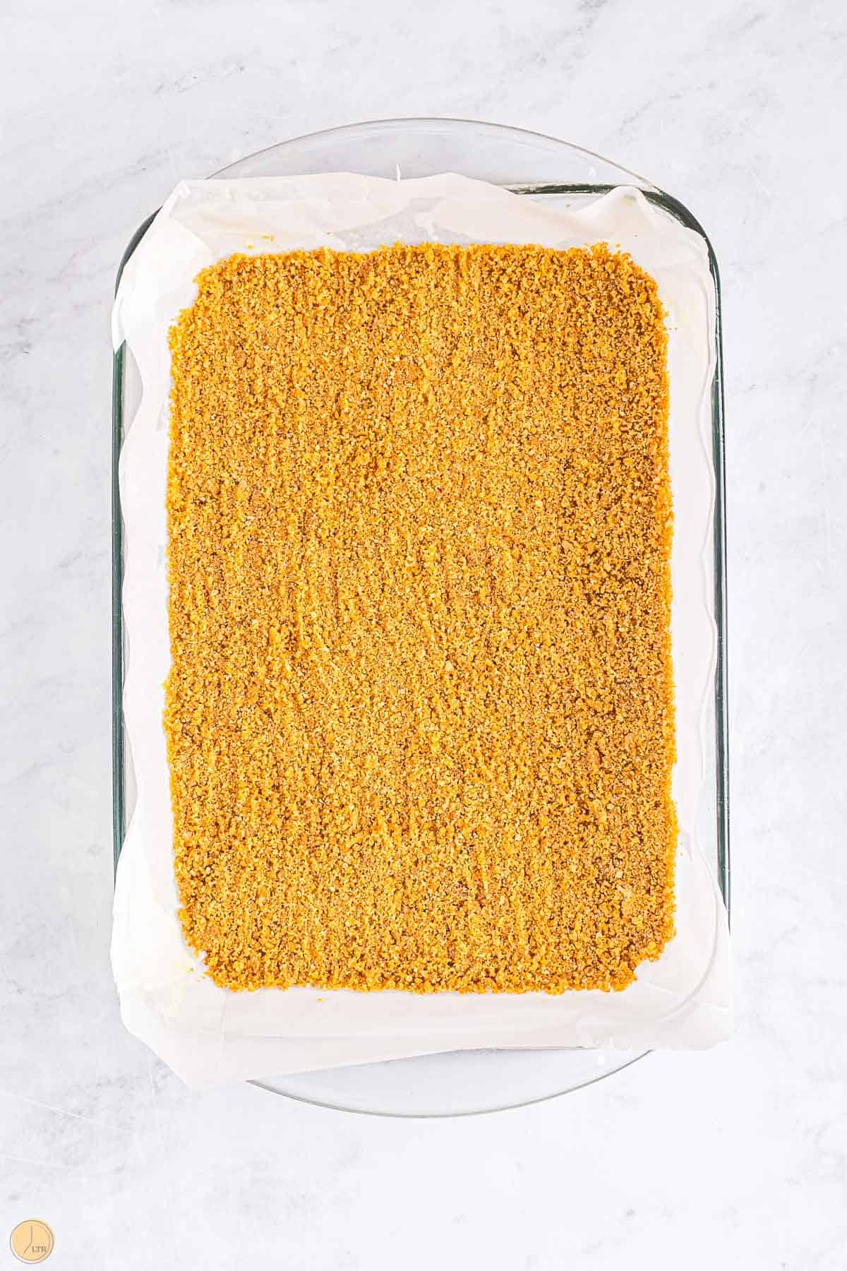 graham cracker crust in the bottom of a pan