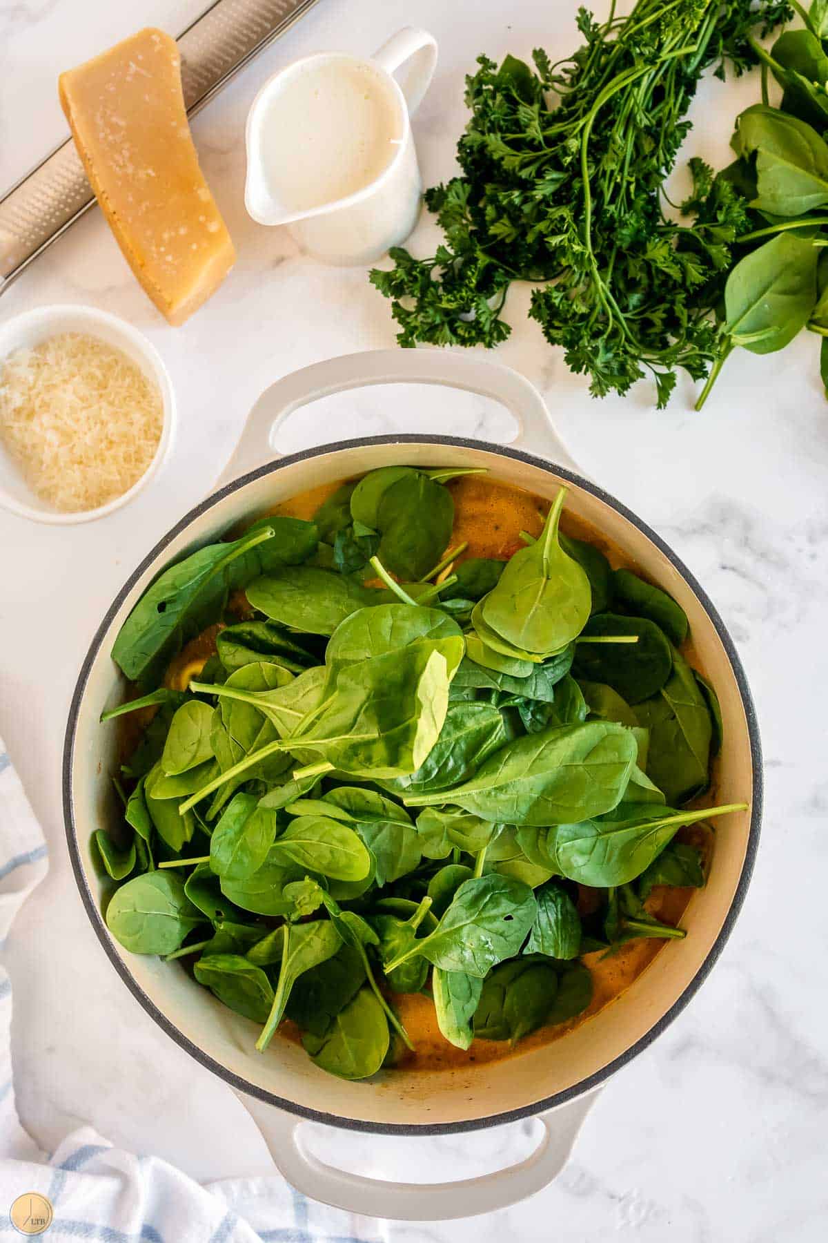 fresh spinach in a soup pot