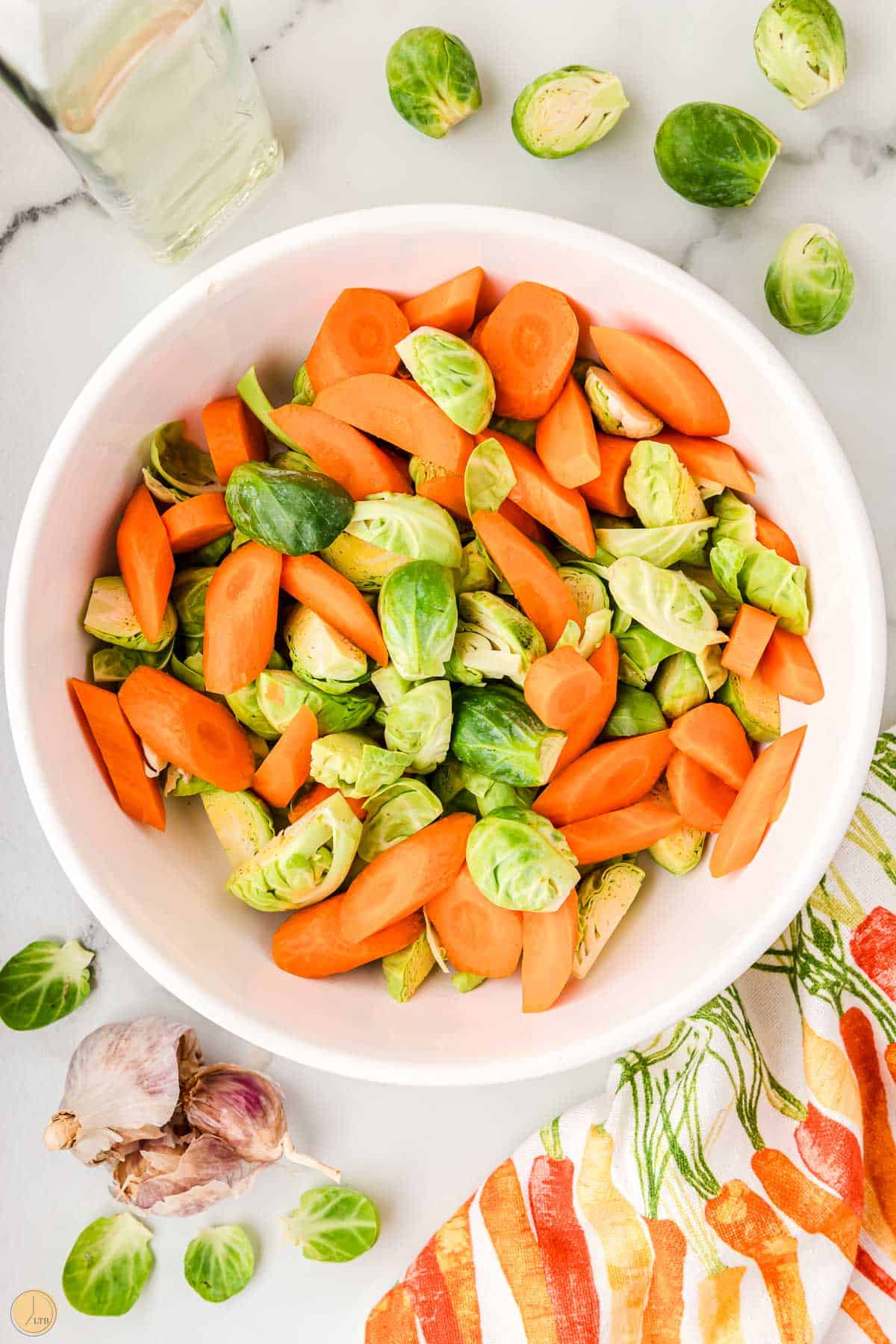 carrots and fresh brussels sprouts in a bowl