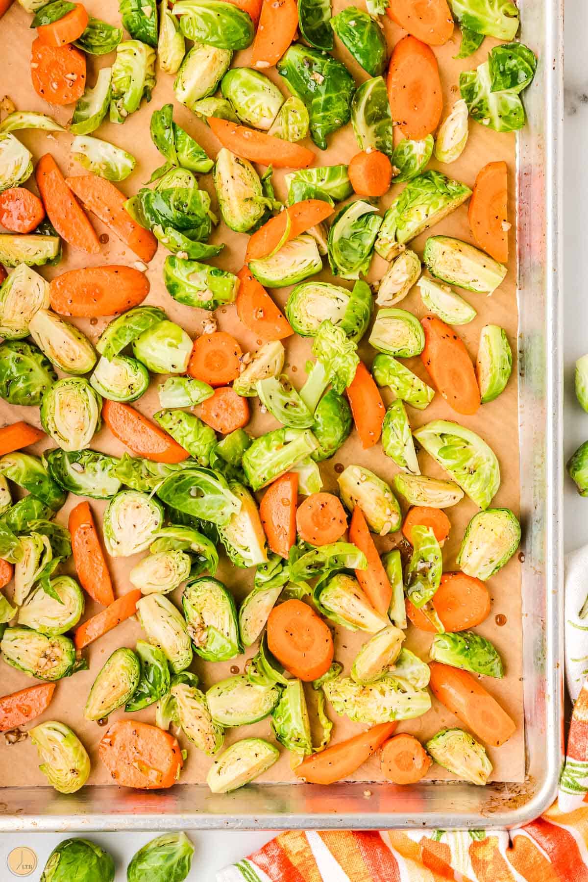 raw vegetables spread on a baking sheet