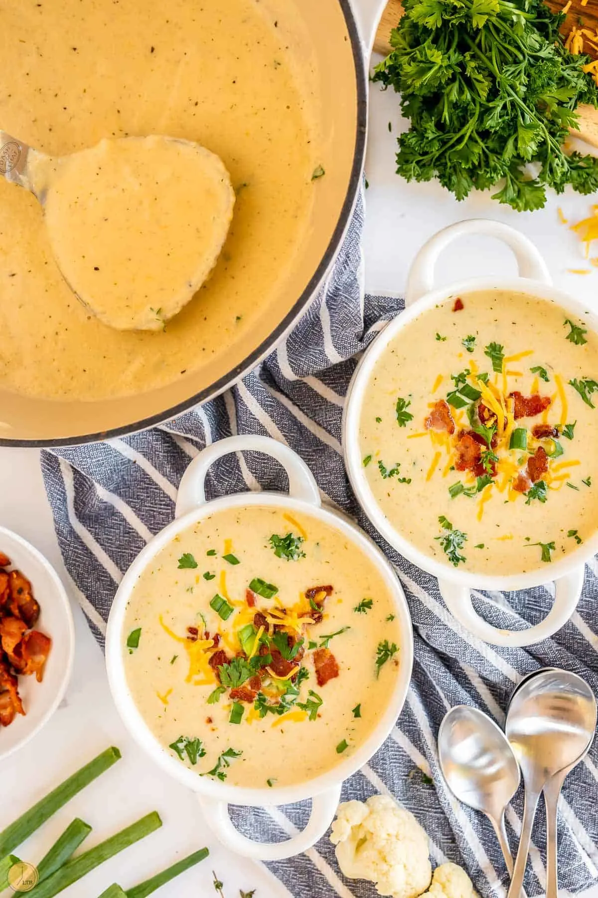 two bowls of cauliflower cheese soup