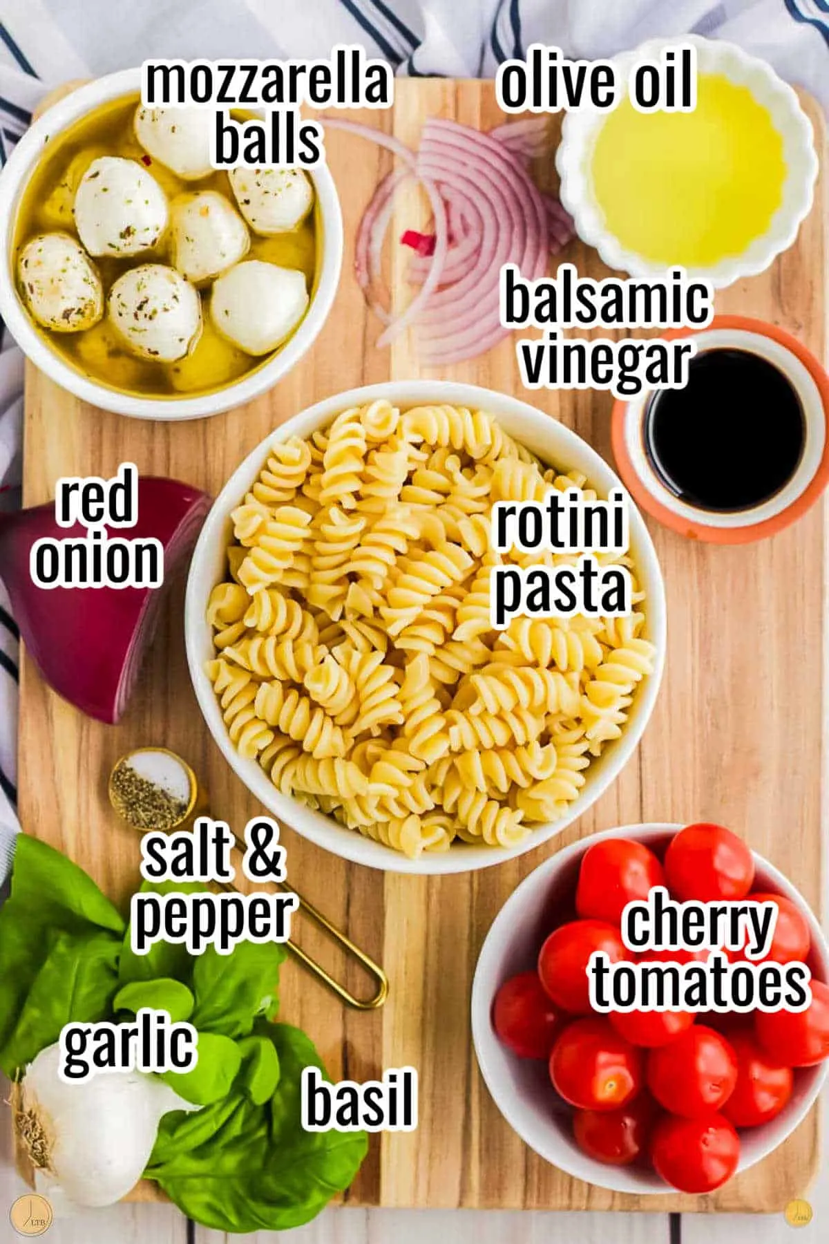 ingredients for a simple recipe that include a pint cherry tomatoes, favorite pasta shape, and pine nuts