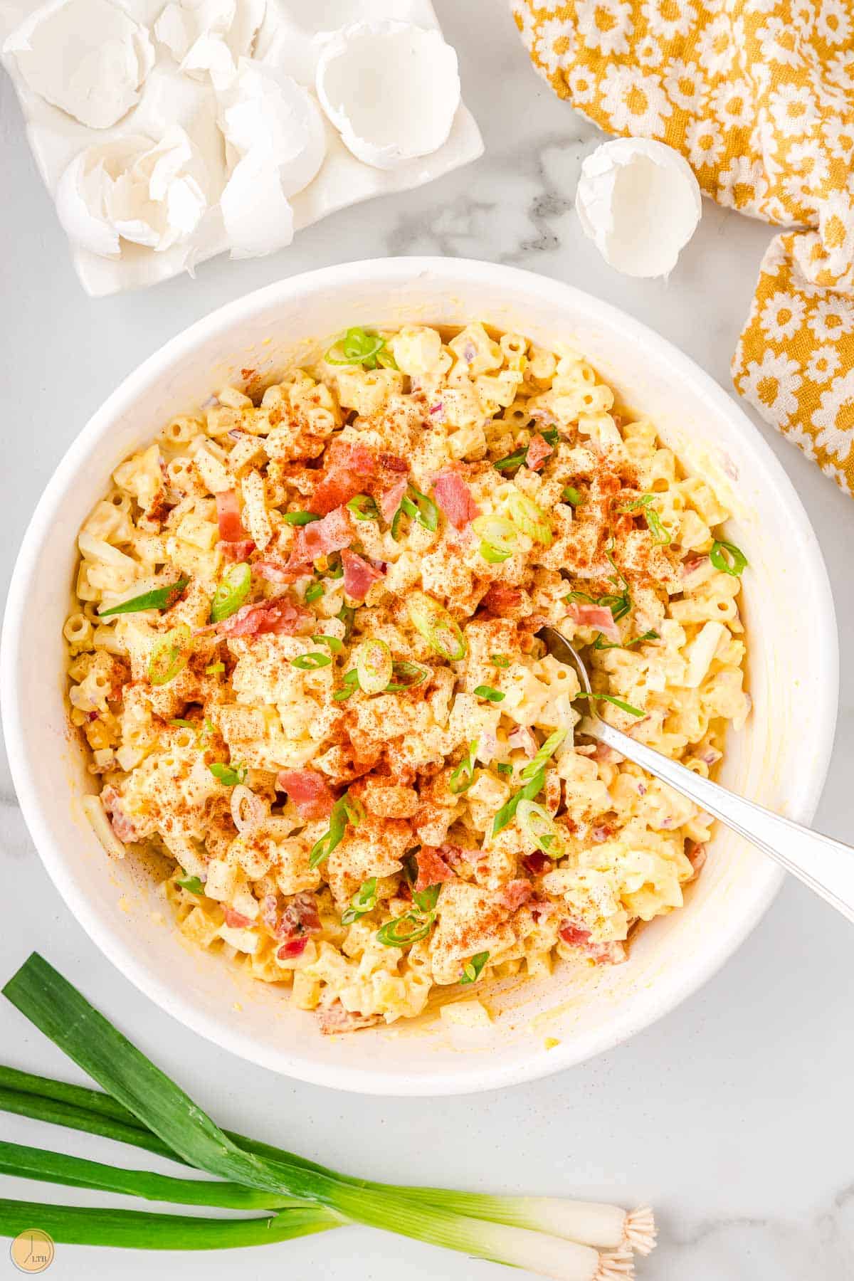 bowl of deviled egg pasta salad with spoon