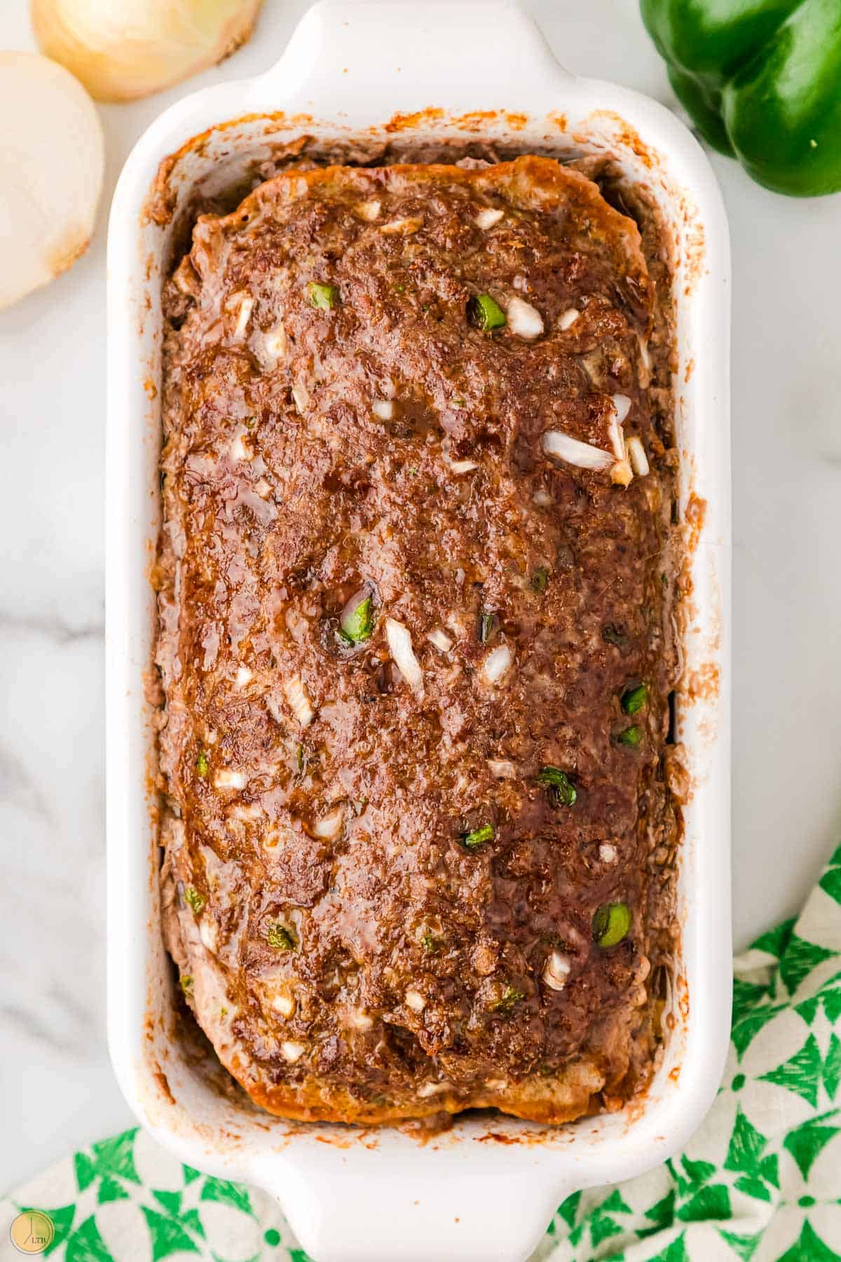 baked meatloaf in a white dish