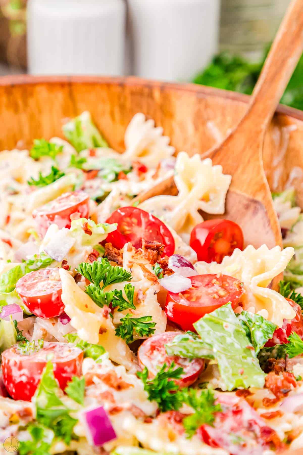 easy pasta salad recipe in a bowl with a spoon