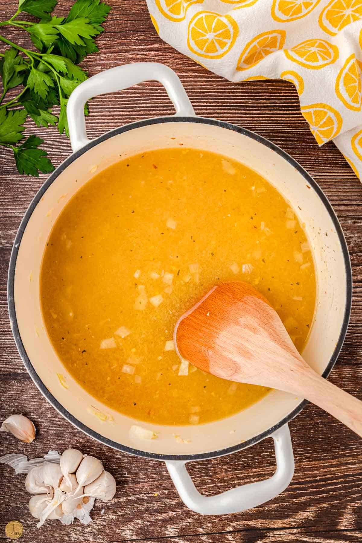 soup in a pot with a wood 
