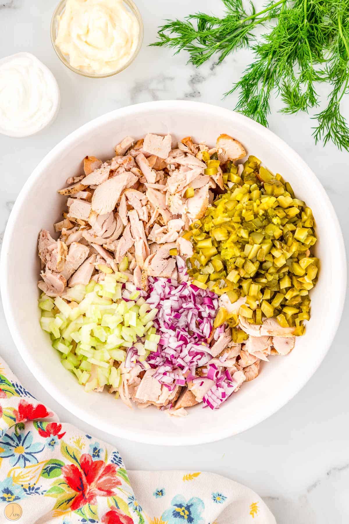unmixed chicken salad ingredients in a bowl