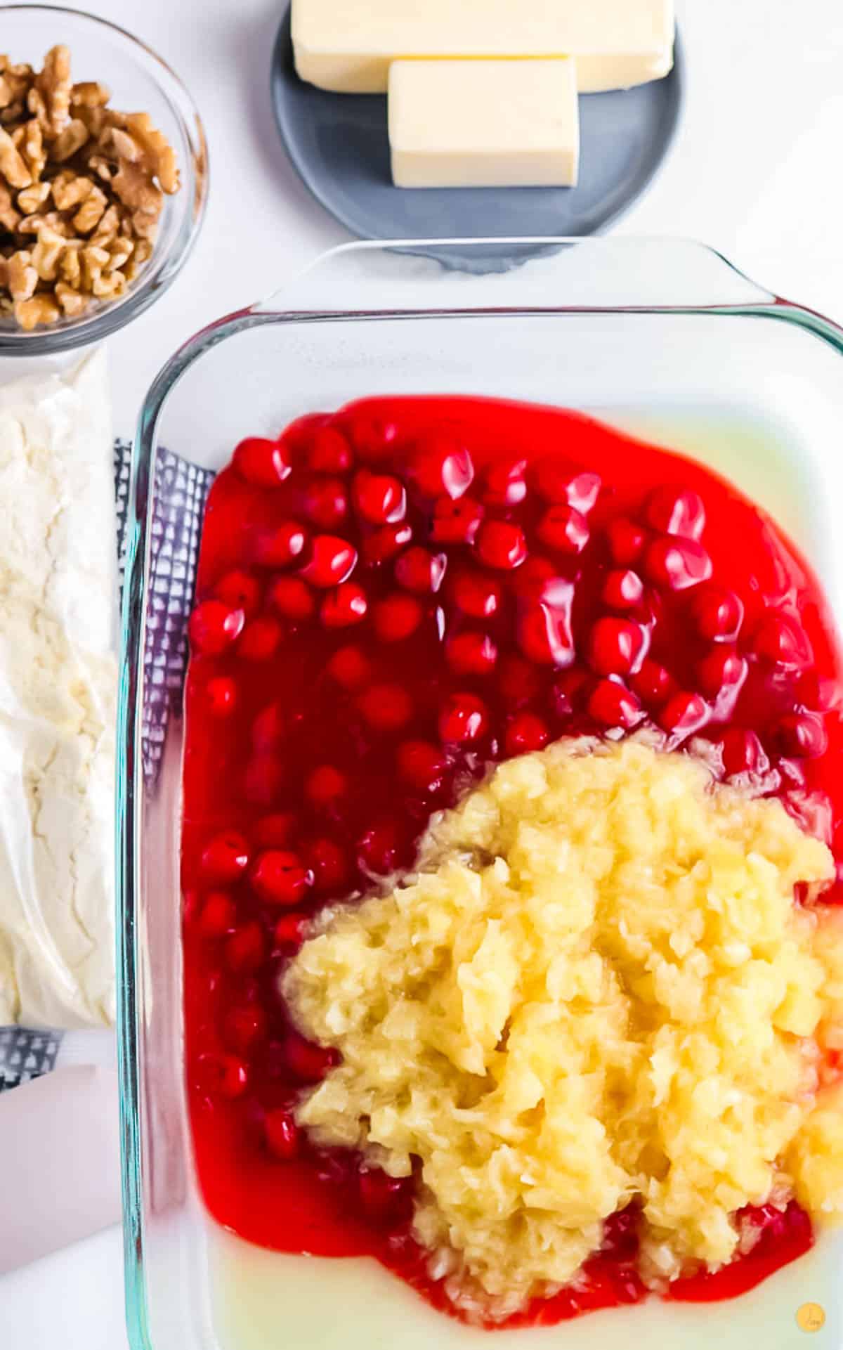 cherry pie filling and crushed pineapple in a casserole dish