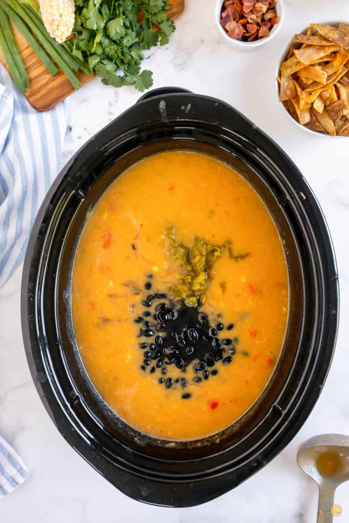 crockpot of soup with black beans