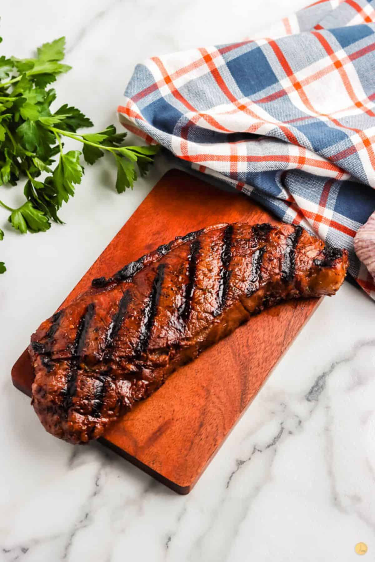 grilled steak on a board